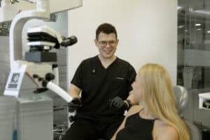 A patient discussing jaw clicking with a Dentist at OptiSmile