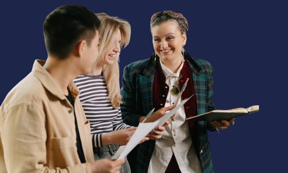 Three adults are consulting together, reviewing printed documents, and showcasing how tongue ties can affect professionals.