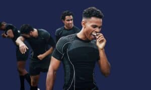 A young athlete fitting a white mouthguard before training, for protecting teeth in sport.